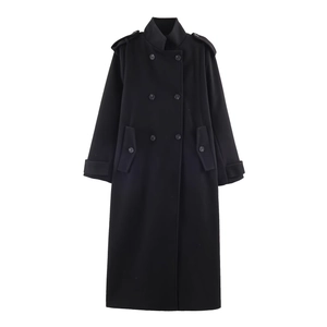 Close-up of black double-breasted wool coat with high stand collar and shoulder epaulettes