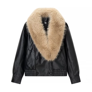 Detail of faux leather jacket with detachable large faux fox fur collar and pebbled texture