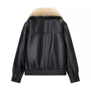 Detail view of black faux leather jacket back with plush beige faux fur collar and grain texture