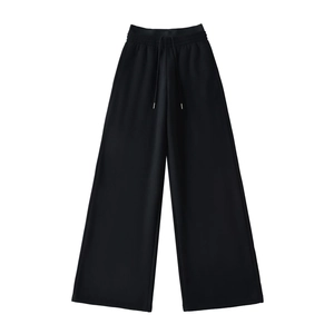 Detail of high waist elastic band and drawstring on black fleece-lined wide leg pants