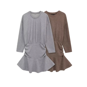 Elegant slim fit long sleeve knit dress with ruched waist and ruffled hem details
