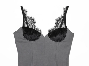 Detail of eyelash lace trim and mixed fabric texture on women's V-neck bustier top