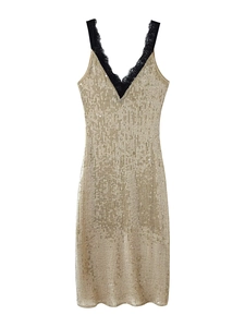 Detail of gold sequins and black lace trim on a sexy V-neck sleeveless bodycon dress
