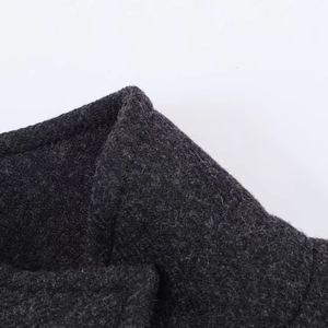 Close-up of the premium dark grey wool blend texture and precise stitching detail