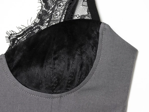 Detail shot of eyelash lace trim and velvet splicing on the V-neckline of grey dress