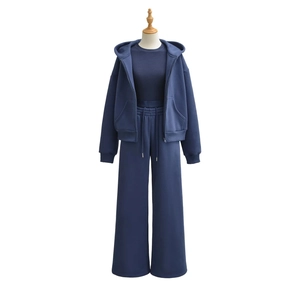 Detailed view of dark blue 3-piece tracksuit with hoodie and drawstring wide-leg pants