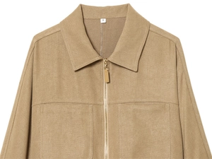 Detailed close-up of camel zip-up jacket with lapel collar and textured fabric pockets