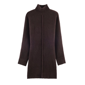 Detail of dark brown knit dress featuring ribbed cuffs and vertical center seam texture