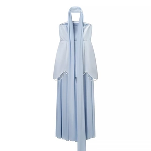 Detail of light blue satin gown with pleated skirt and double-row pearl waist decoration