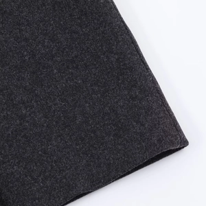Close-up of charcoal grey wool blend fabric showing neat stitching and heavy texture