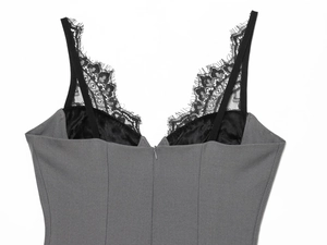 Detail of eyelash lace trim and invisible zipper on a slim fit V-neck grey camisole dress