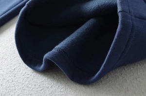 Close-up of navy thick fleece lining on American-style winter wide-leg sweatpants