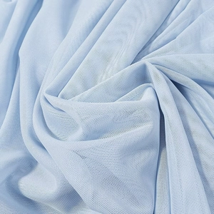 Detailed close-up of light blue fine mesh fabric texture with soft semi-transparent finish