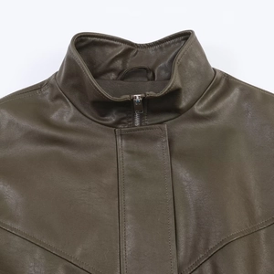 Detail of olive green faux leather bomber jacket with stand collar and V-shaped stitching