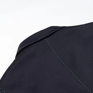 Macro shot of high-quality quilted fabric texture with contrast stitching on jacket shoulder