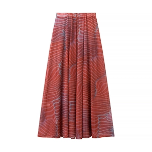 Detailed close-up of the flowing chiffon fabric with abstract red and purple wave patterns