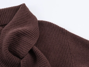 Macro shot of dark brown rib-knit texture and seam detail of this winter sweater