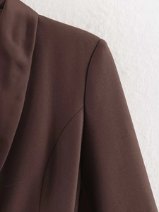 Detail of the structured shoulder and lapel on this premium dark brown blazer