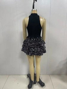 Detailed back view of sleeveless sequin mini dress with layered skirt and chic high neck