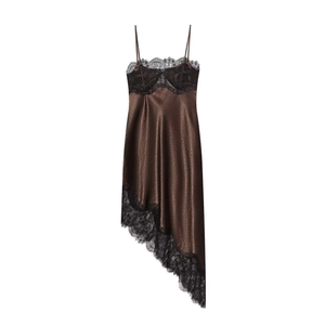 Detail of brown satin slip dress showing black lace trim and asymmetrical hemline