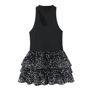 Detailed view of black sequins tutu dress with tiered mesh layers and halter neckline