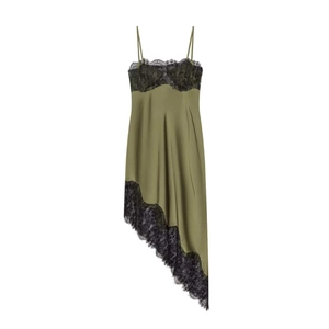Detail of olive green satin dress with black lace trim on neckline and irregular hem