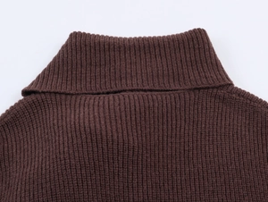 Detail view of coffee brown ribbed knit sweater featuring a thick turtleneck collar