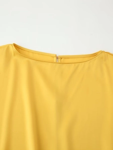 Detail showing the bright yellow crew neckline with a back keyhole and metal hook closure