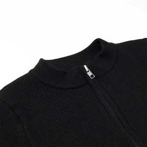 Detail of black ribbed knit bodysuit with silver metal zipper and mock neck collar