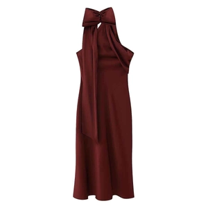 Elegant wine red satin midi dress with halter neck and large bow detail on white backdrop
