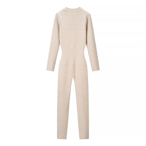 Slim fit long sleeve jumpsuit in beige knitted fabric with waist-shaping design