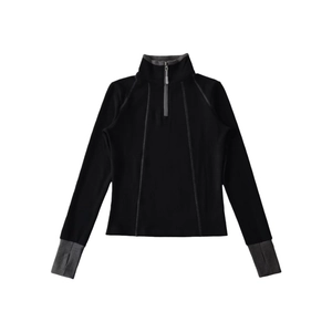 Close-up of contrast stitching and thumbhole cuff on a half-zip thermal sports top