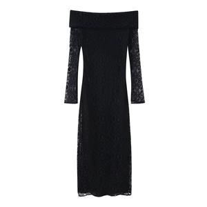 Close-up of semi-transparent floral lace texture on a black long-sleeve dress