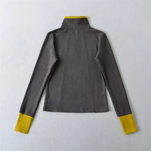 Detail of high collar and contrast yellow cuffs on slim fit thermal long sleeve top