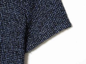 Macro-opname van de zwart en blauw geweven tweed stof met contrasterende textuur