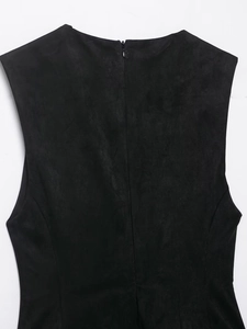 Macro shot of back hidden zipper and matte suede fabric texture on black dress