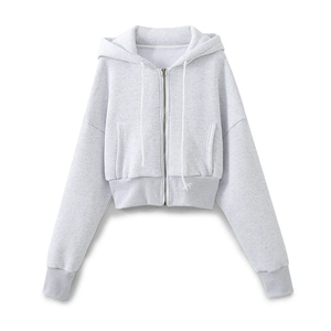 Detail of light gray cropped zip-up hoodie with adjustable drawstring and ribbed cuffs