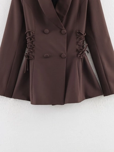 Detailed view of dark brown double-breasted blazer with side lace-up corset waist design