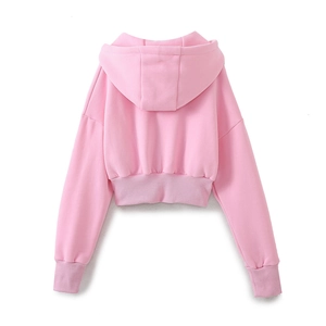Detail view of pink cropped hoodie back showing ribbed cuffs and hem on white background