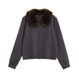 Detailed view of charcoal knit cardigan featuring a brown faux fur collar and small buttons