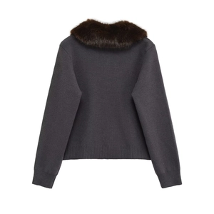 Detail view of the deep grey knit cardigan featuring a thick faux fur collar on the back