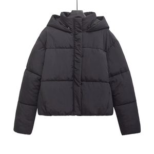 Detail of black hooded puffer jacket with quilted horizontal stitching and matte finish