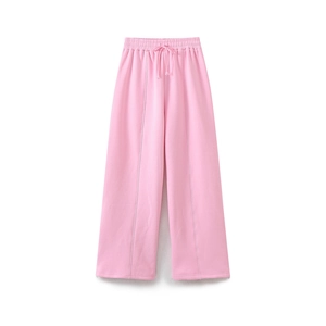 Detail of pink wide-leg sweatpants featuring high elastic waist and front seam details