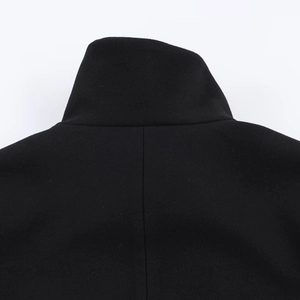 Close-up of winter black wool coat with stylish stand collar and precise back stitching
