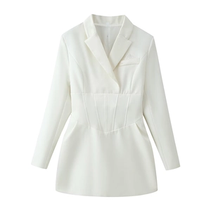 Detail of white blazer dress showing corset-style waist tailoring and radiating topstitch