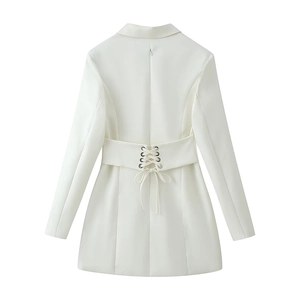 Back view detail of white blazer dress showing lace-up waist with metal eyelets