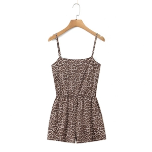 Close-up of leopard print romper showing the elastic waist and thin spaghetti straps