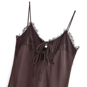 Detail of dark brown satin camisole featuring black eyelash lace and front lace-up