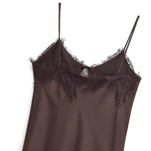 Detail of dark brown satin slip dress featuring exquisite eyelash lace trim at neckline
