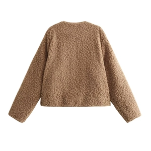 Detail view of brown fleece jacket back showcasing thick teddy texture and warm plush fabric
